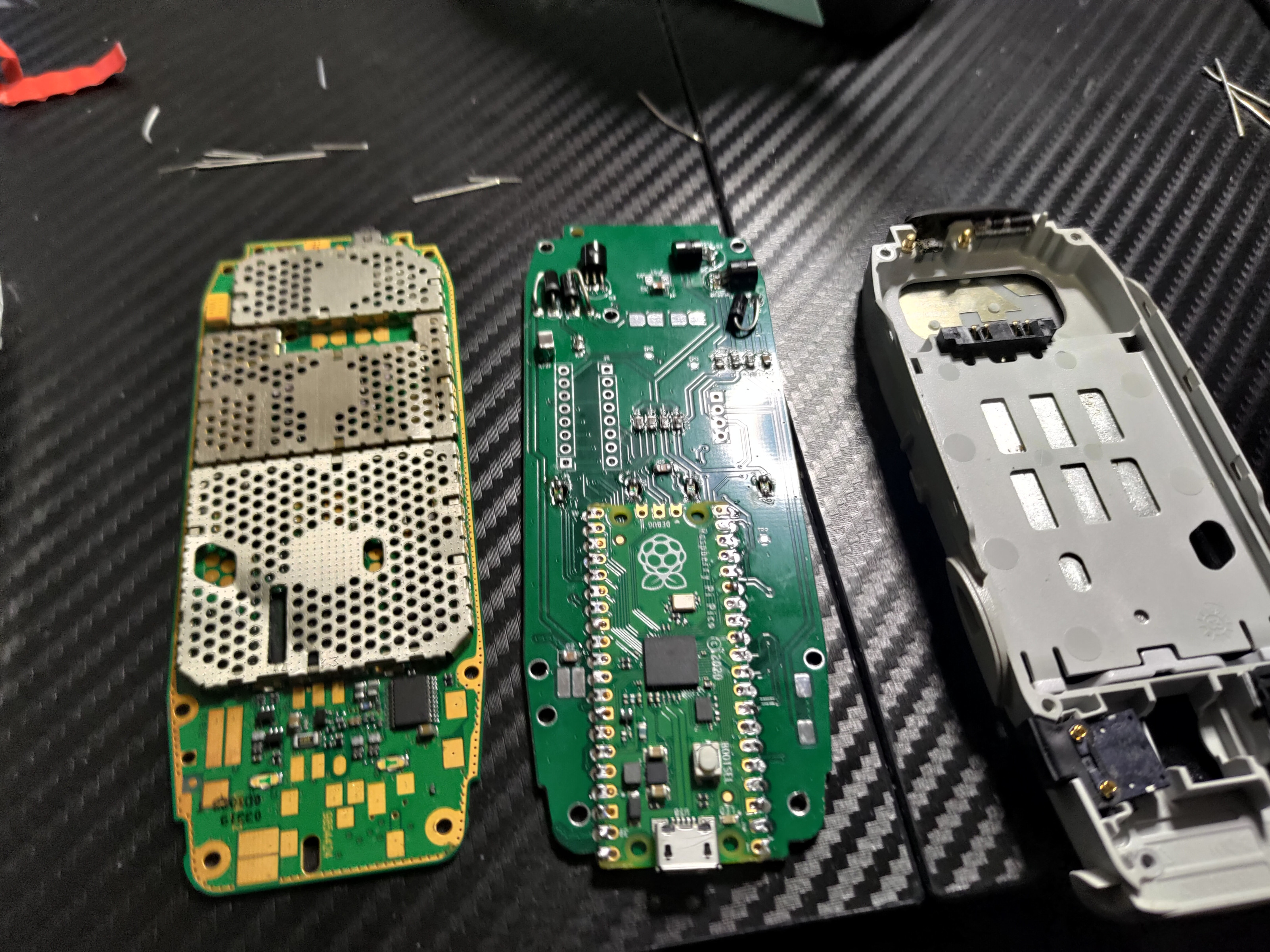 Nokia 3310 stock motherboard compared with Raspberry Pi Pico custom PCB