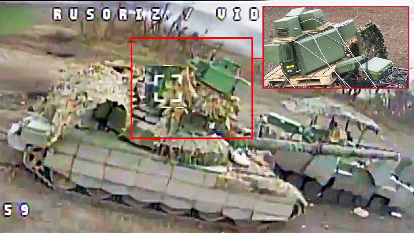 Improvised electronic warfare jammer mounted on a Russian tank turret — a makeshift signal-jamming tower of antennas welded onto a frame, a common low-cost drone countermeasure on the battlefield. Source: Telegram / Kyiv Post