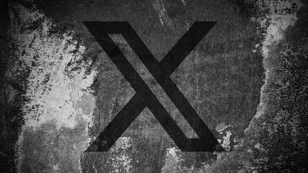 X（前 Twitter）logo 出现在破裂墙面上